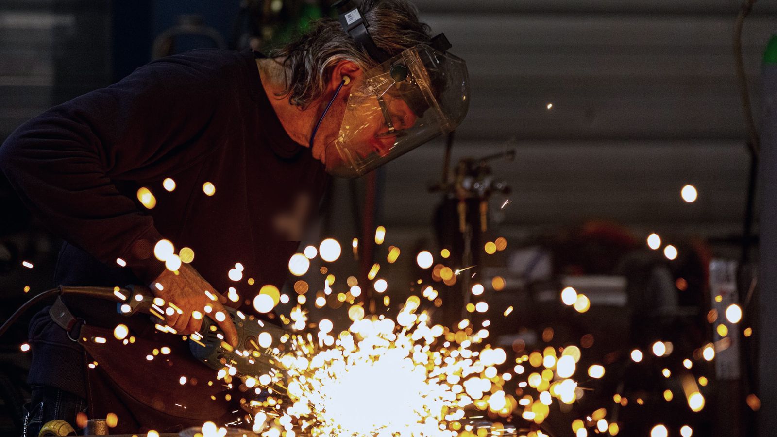 Welder at work with sparks